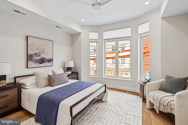 bedroom featuring visible vents, light wood-style flooring, and recessed lighting