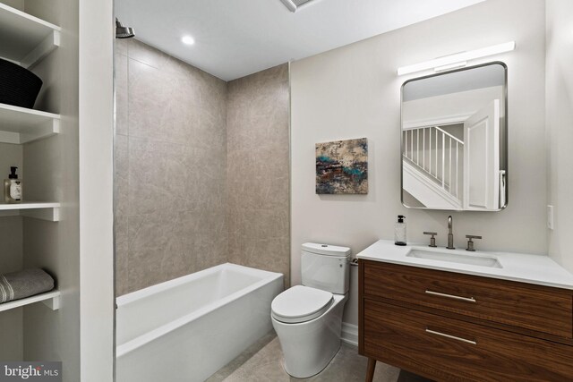 full bathroom featuring vanity, toilet, tile patterned floors, and tiled shower / bath combo