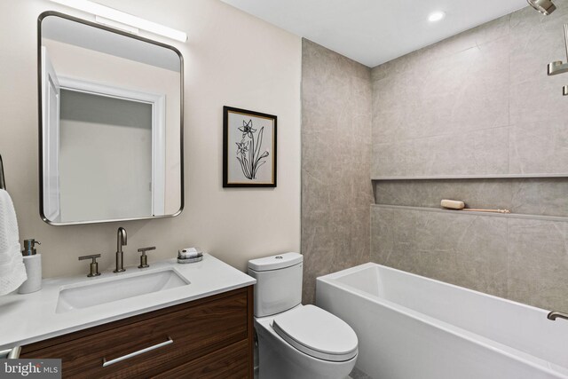 full bath with toilet, bathtub / shower combination, and vanity