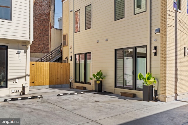 rear view of house with fence