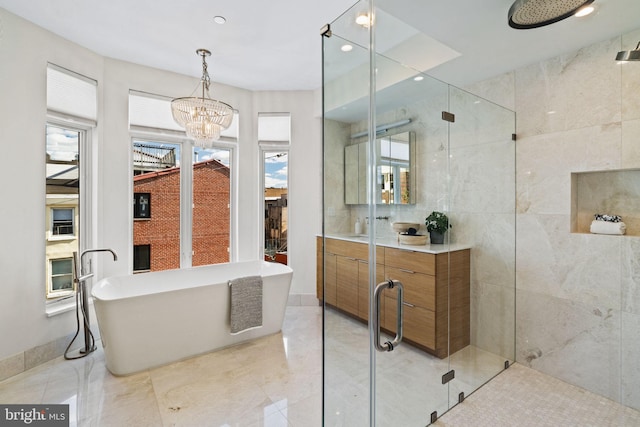 bathroom with plus walk in shower, an inviting chandelier, and a healthy amount of sunlight