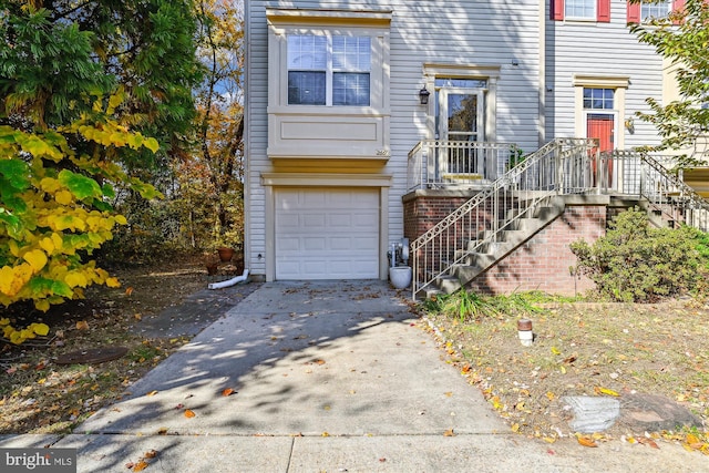 multi unit property featuring a garage