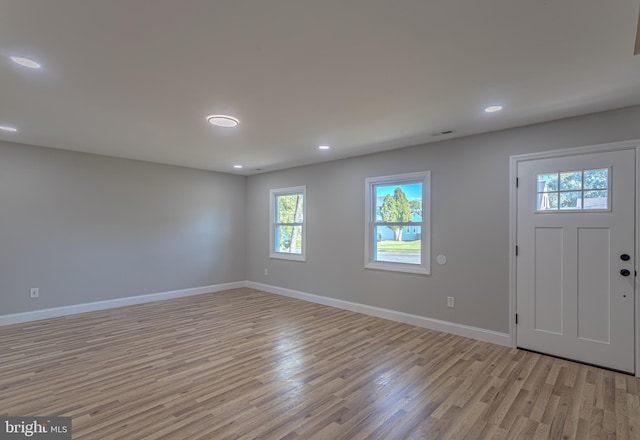 foyer with light hardwood / wood-style floors