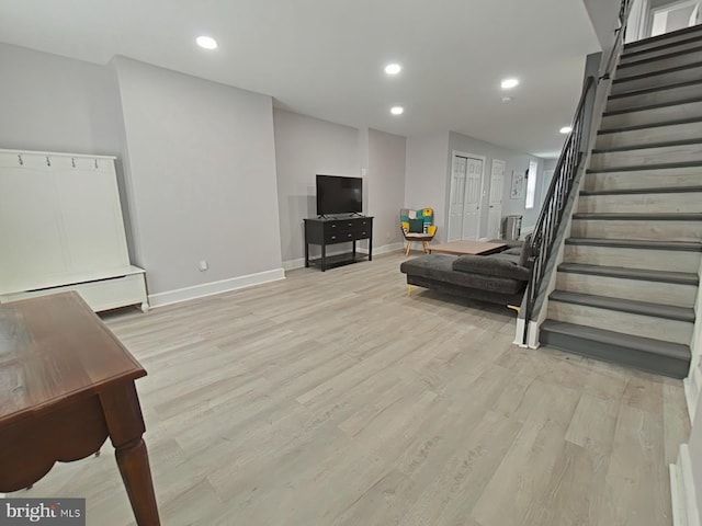 living room with light hardwood / wood-style flooring