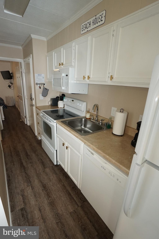 kitchen with white cabinets, dark hardwood / wood-style flooring, crown molding, sink, and white appliances