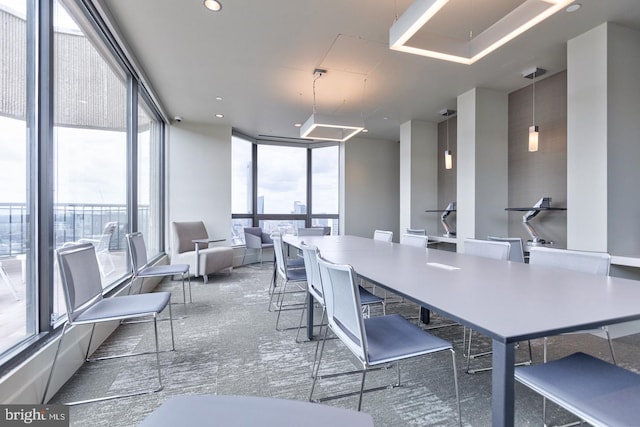 dining space with floor to ceiling windows