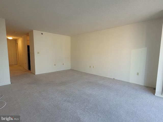 empty room featuring light colored carpet