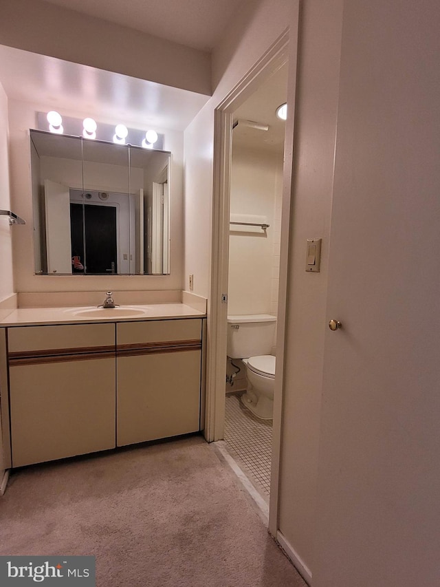 bathroom with vanity and toilet