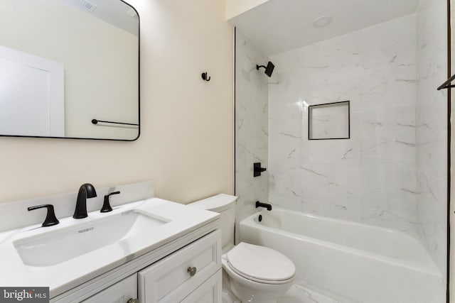 full bathroom with tiled shower / bath combo, toilet, and vanity