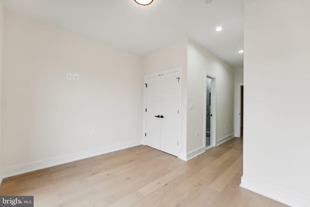 empty room with light hardwood / wood-style floors