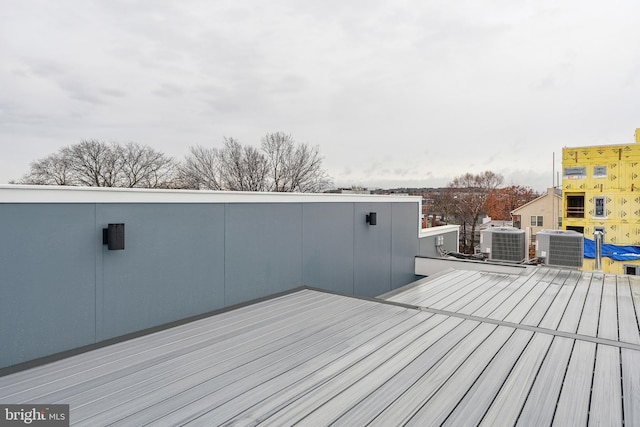 wooden deck with central air condition unit