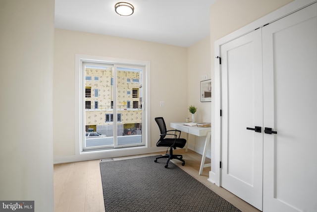 office area featuring light hardwood / wood-style floors and a wealth of natural light