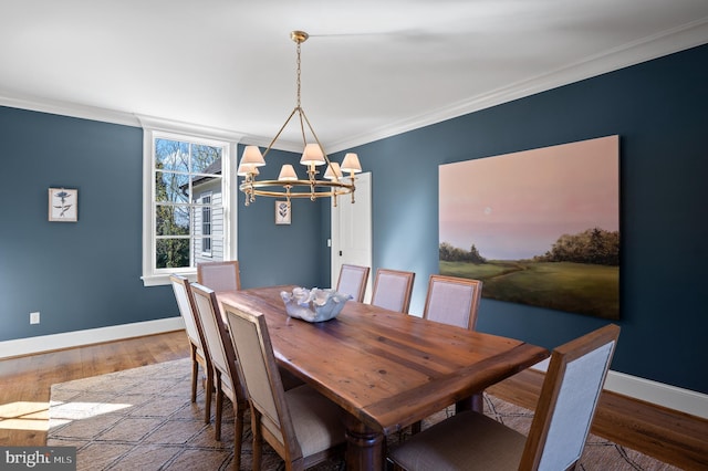 1484 W Strasburg Rd, West Chester, PA 19382 - dining space featuring baseboards, ornamental molding, wood finished floors, and a notable chandelier