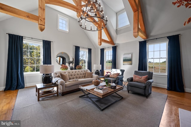 1484 W Strasburg Rd, West Chester, PA 19382 - living area featuring a notable chandelier, baseboards, beamed ceiling, and wood finished floors