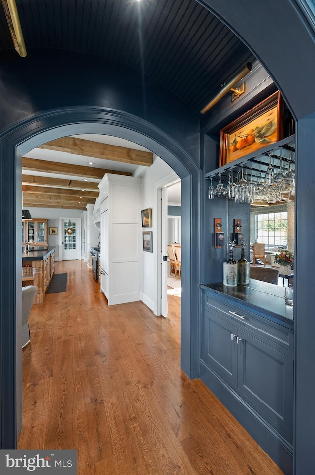 1484 W Strasburg Rd, West Chester, PA 19382 - interior space with arched walkways, a dry bar, wood finished floors, and beam ceiling