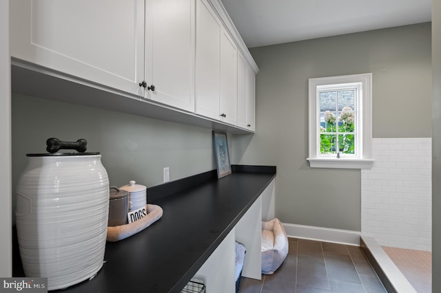 1484 W Strasburg Rd, West Chester, PA 19382 - laundry area featuring baseboards and dark tile patterned flooring
