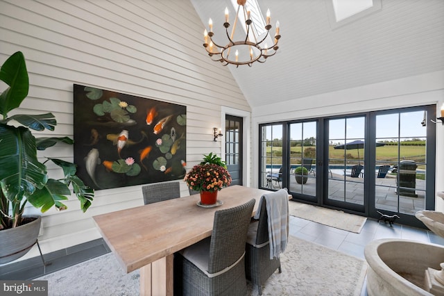 1484 W Strasburg Rd, West Chester, PA 19382 - tiled dining area with high vaulted ceiling, a chandelier, and french doors