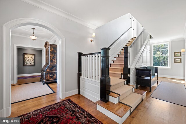1484 W Strasburg Rd, West Chester, PA 19382 - entrance foyer featuring baseboards, ornamental molding, wood finished floors, and arched walkways