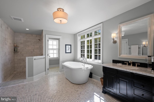 1484 W Strasburg Rd, West Chester, PA 19382 - bathroom featuring baseboards, a walk in shower, vanity, and a freestanding bath