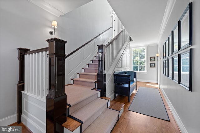 1484 W Strasburg Rd, West Chester, PA 19382 - staircase featuring baseboards, crown molding, and wood finished floors