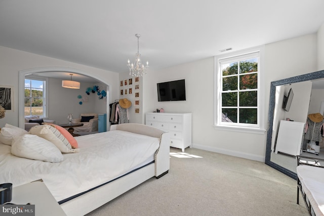 1484 W Strasburg Rd, West Chester, PA 19382 - bedroom featuring visible vents, a chandelier, light carpet, arched walkways, and multiple windows