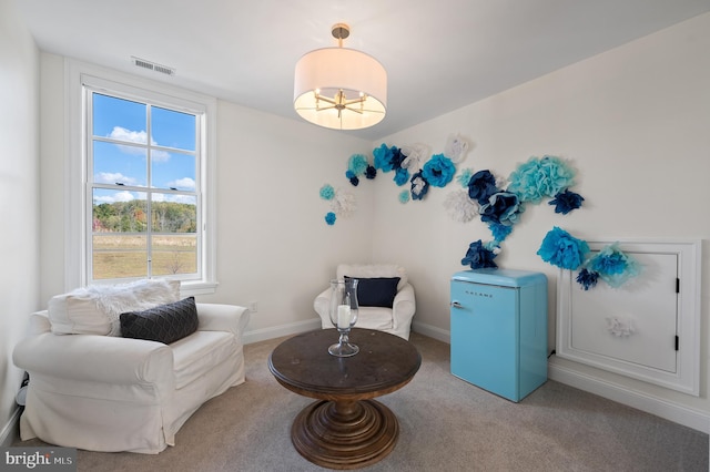1484 W Strasburg Rd, West Chester, PA 19382 - living area with a notable chandelier, carpet, baseboards, and visible vents