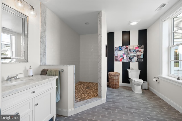 1484 W Strasburg Rd, West Chester, PA 19382 - full bathroom with toilet, a walk in shower, vanity, baseboards, and visible vents