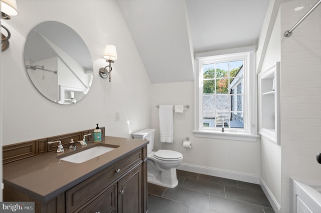 1484 W Strasburg Rd, West Chester, PA 19382 - full bathroom with baseboards, toilet, vanity, vaulted ceiling, and tile patterned flooring