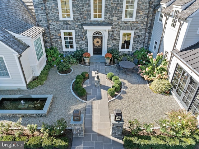 1484 W Strasburg Rd, West Chester, PA 19382 - property entrance with a patio area and stone siding