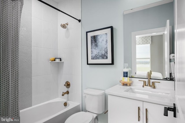 full bathroom with vanity, shower / bath combo with shower curtain, and toilet