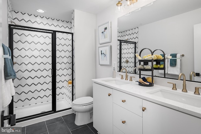 bathroom featuring vanity, toilet, walk in shower, and tile patterned flooring