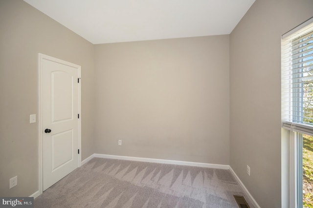 empty room with light colored carpet