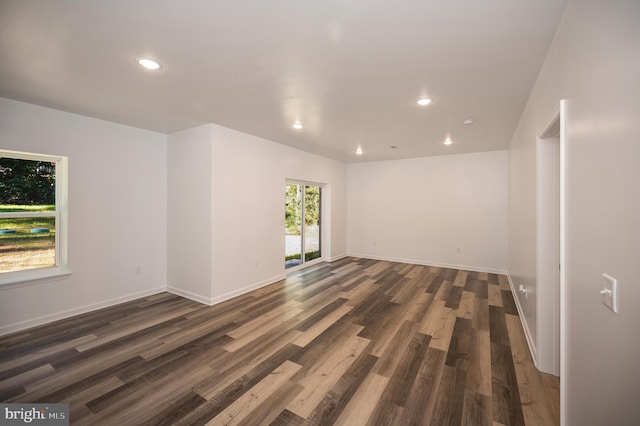 spare room featuring dark wood-type flooring