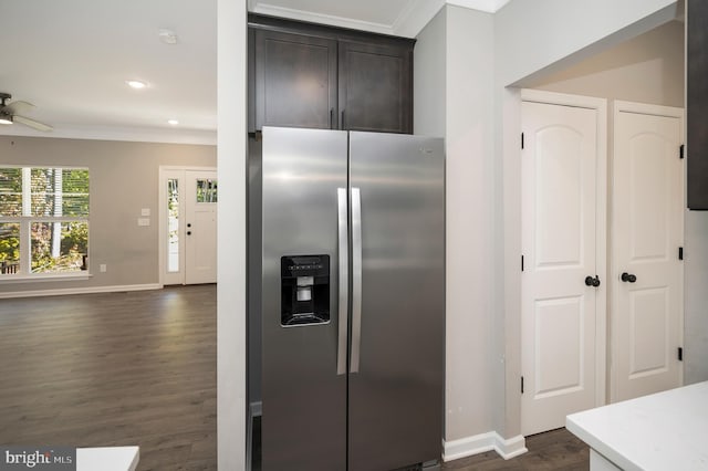 kitchen with ceiling fan, dark hardwood / wood-style flooring, crown molding, dark brown cabinetry, and stainless steel fridge