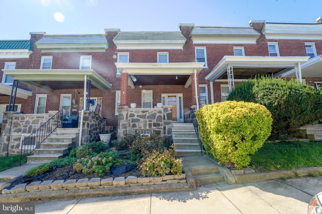 view of property featuring covered porch