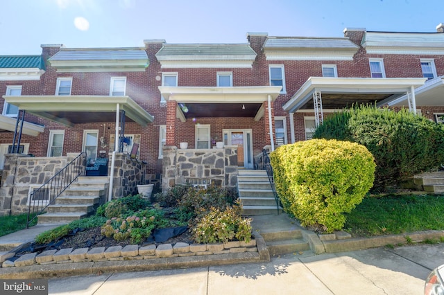 view of property featuring covered porch