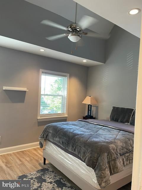 bedroom featuring wood-type flooring and ceiling fan