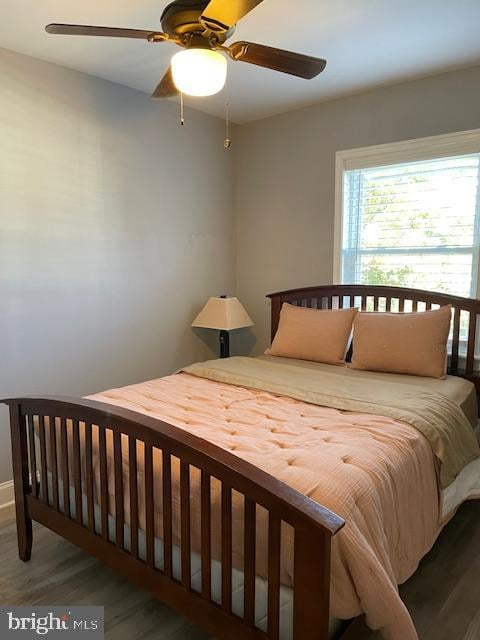 bedroom with hardwood / wood-style flooring and ceiling fan