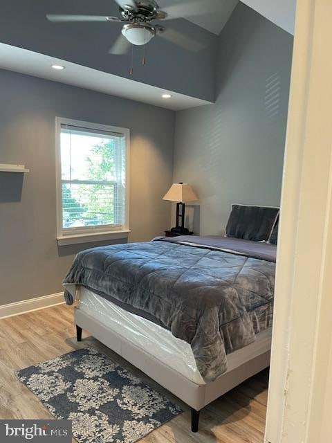 bedroom featuring hardwood / wood-style flooring and ceiling fan