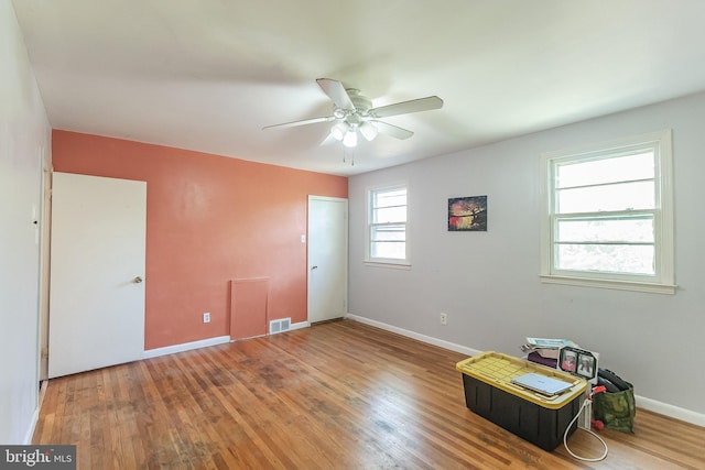 miscellaneous room with hardwood / wood-style flooring and ceiling fan