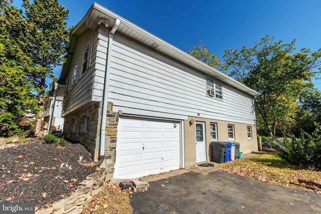 view of property exterior featuring a garage