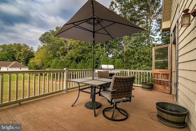 wooden terrace featuring grilling area