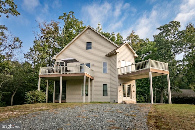 back of property featuring a deck