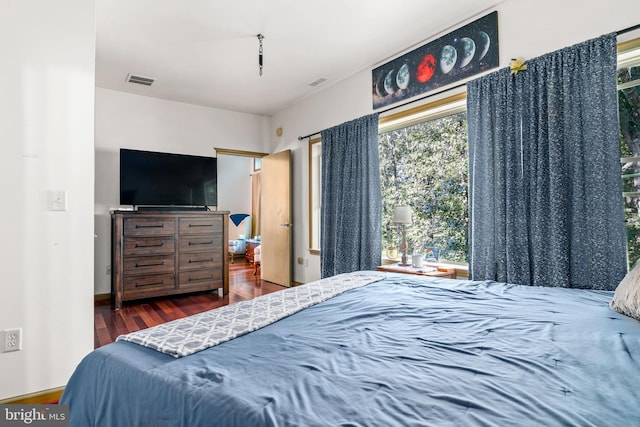 bedroom featuring dark wood-type flooring