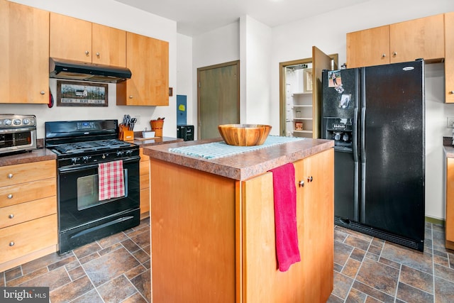 kitchen with black appliances and a kitchen island