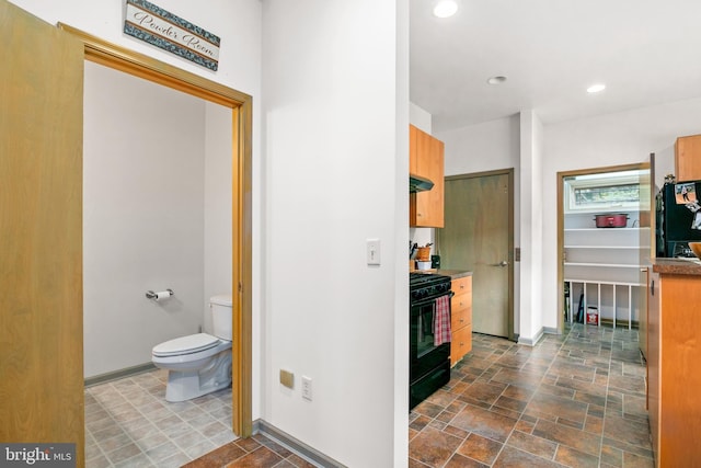 bathroom featuring toilet