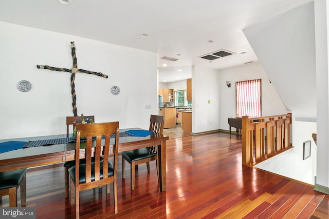 dining room with hardwood / wood-style flooring