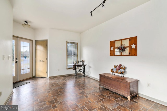 entryway featuring rail lighting