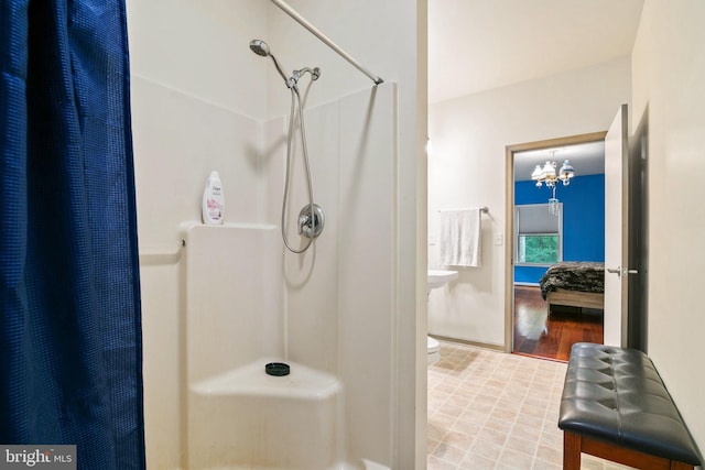 bathroom featuring toilet, wood-type flooring, and a shower with shower curtain