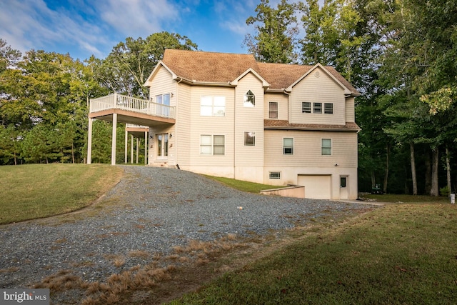 view of front of house featuring a garage and a front lawn